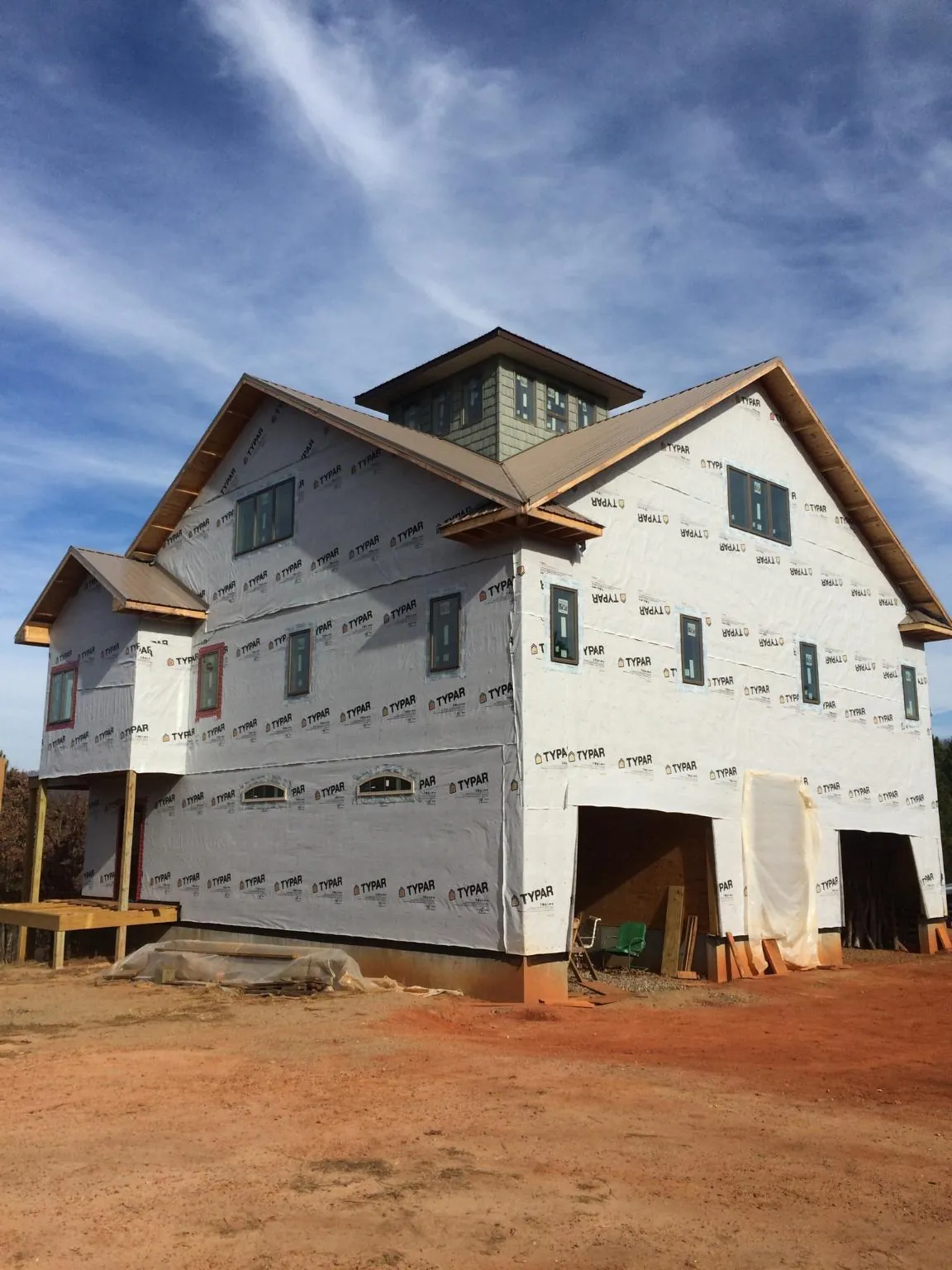 New two story house under construction with a cupola and gabled roofs in Secaucus